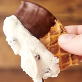 chocolate chip cannoli dip on a waffle cone chip
