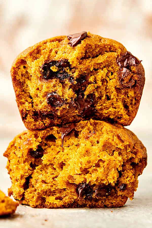two pumpkin chocolate chip muffins stacked