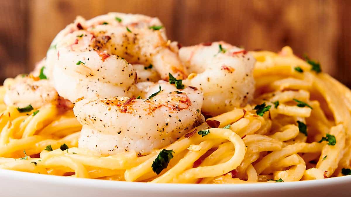 bang bang shrimp pasta on a plate