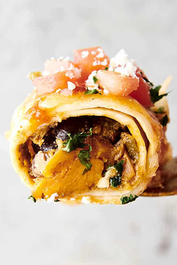 enchilada stuffed with black beans and roasted sweet potatoes