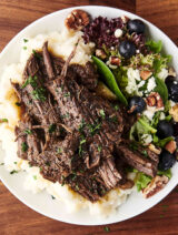 braised beef served with potatoes and salad