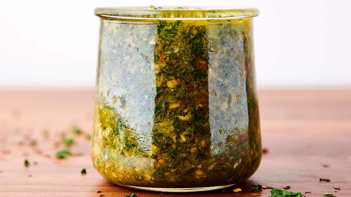 glass jar full of chimichurri sauce