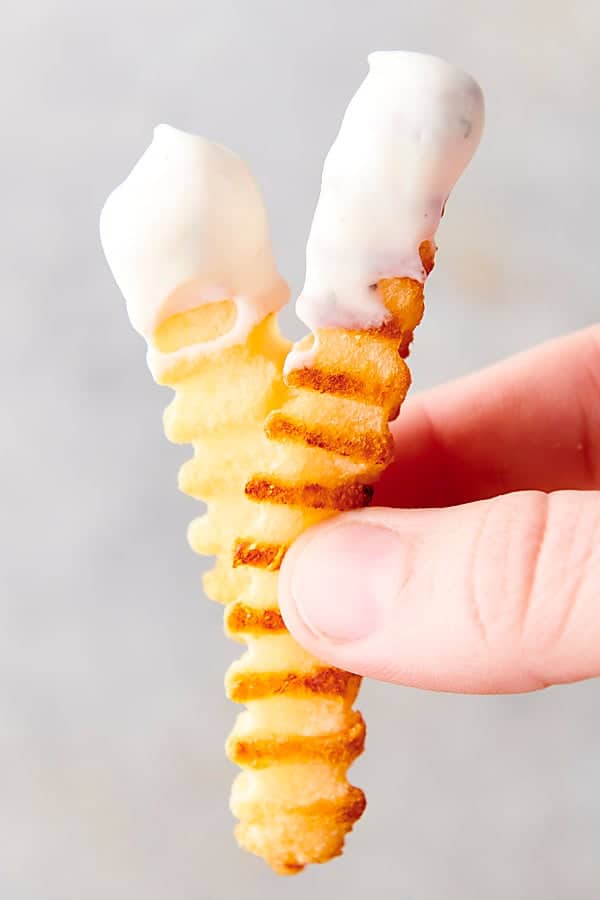 french fries dunked in homemade ranch dressing