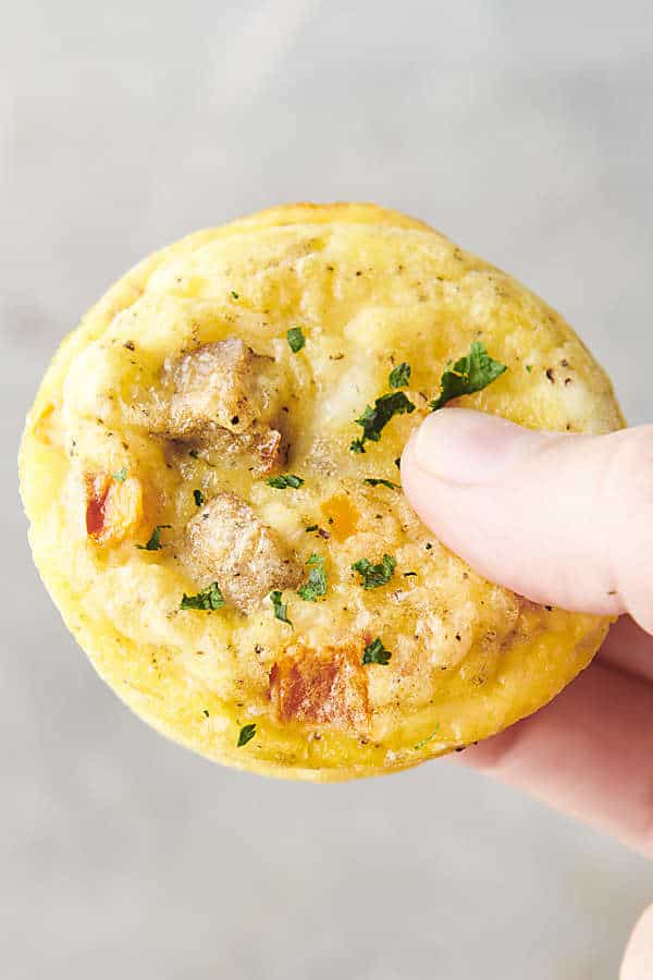 holding a breakfast egg muffin