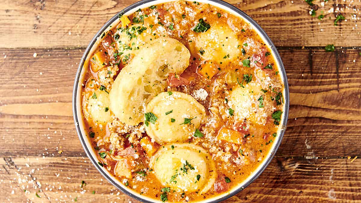 bowl of italian sausage and cheese ravioli soup