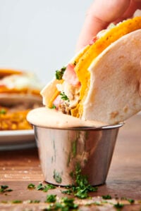 taco bell dupe: cheesy gordita crunch dunking in spicy ranch