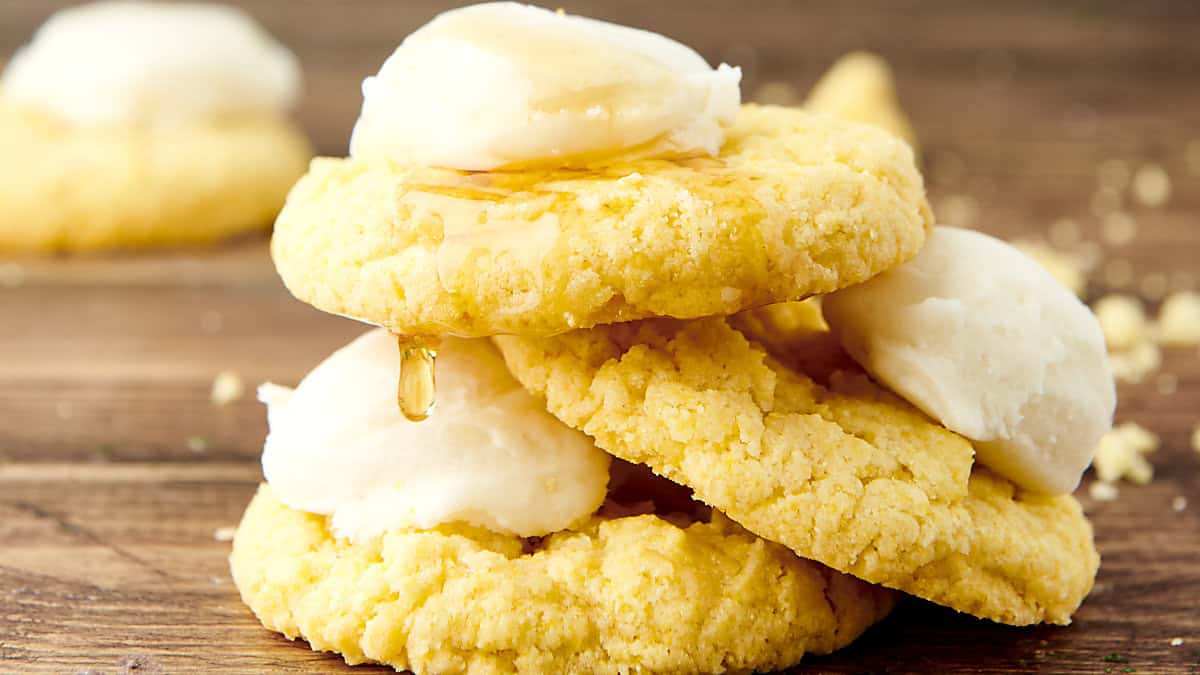stack of cornbread cookies with honey buttercream frosting