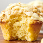 orange crumb muffin with a bite taken out of it
