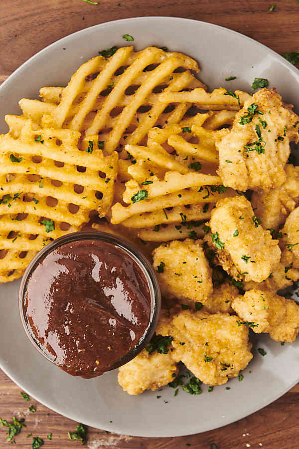 Plate of fries with barbecue sauce