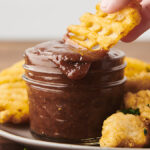 Dipping a waffle fry into homemade BBQ sauce