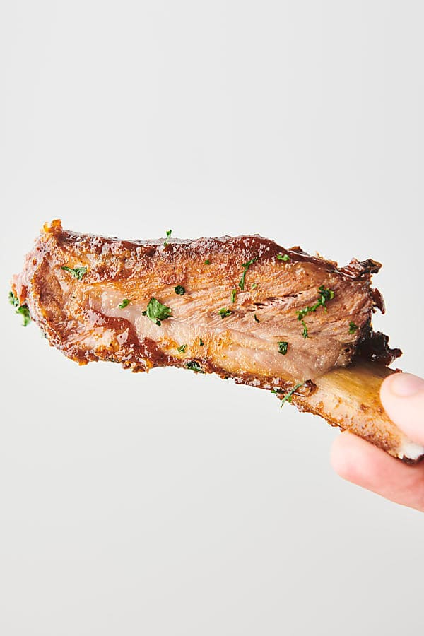 Holding a St. Louis pork rib