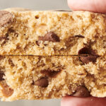 holding a bisquick chocolate chip cookie