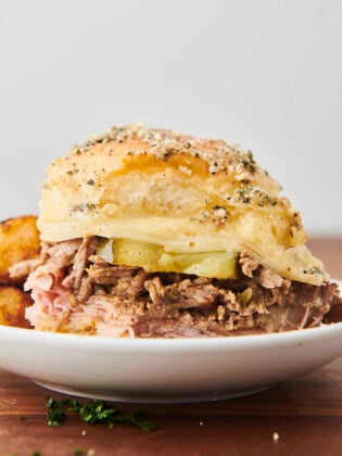 cuban slider with ham, pork, cheese, honey mustard, and pickles