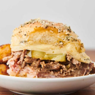 cuban slider with ham, pork, cheese, honey mustard, and pickles