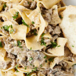 plate of ground beef stroganoff with egg noodles and mushrooms