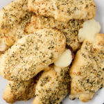 canned garlic butter crescent rolls stuffed with cheese on a plate