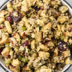 stove top stuffing in a bowl with sausage, cranberries, and pecans