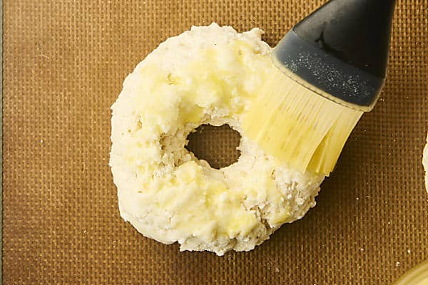 brushing bagel with egg wash