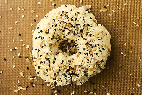 sprinkling bagels with everything but the bagel seasoning before baking
