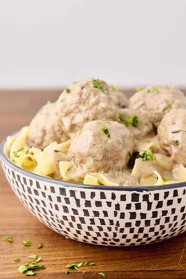 meatballs, gravy, and noodles in a bowl