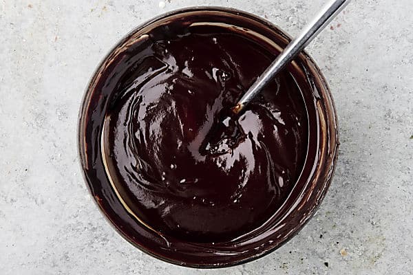 melted chocolate and cream in a bowl