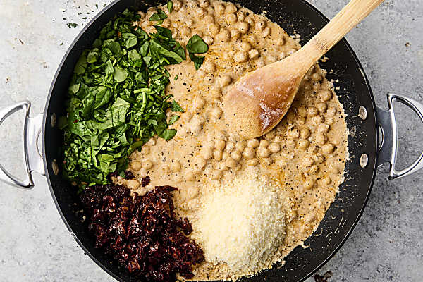 adding spinach, sun dried tomatoes, and parmesan 