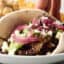 crockpot chuck roast taco with pickled onions and avocado sauce