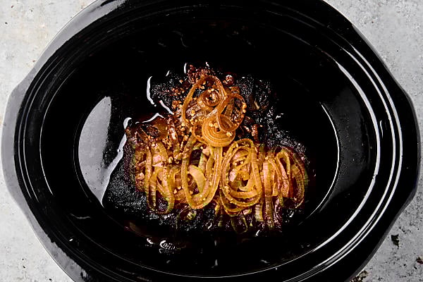 cooked onions and chuck roast in the crockpot