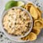 creamy Mexican street corn dip in a bowl with chips