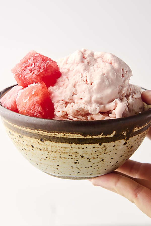 holding a bowl of watermelon sherbet