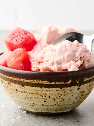 scooping into a bowl of no churn watermelon sherbet