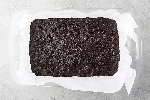 oreo cookie crust pressed into a pan
