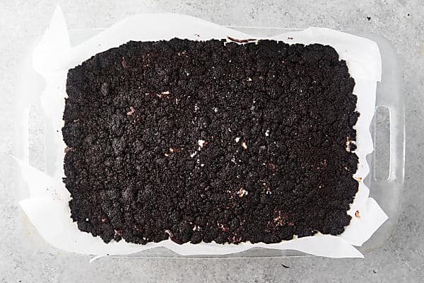 cookie crust pressed on top of semi-frozen ice cream