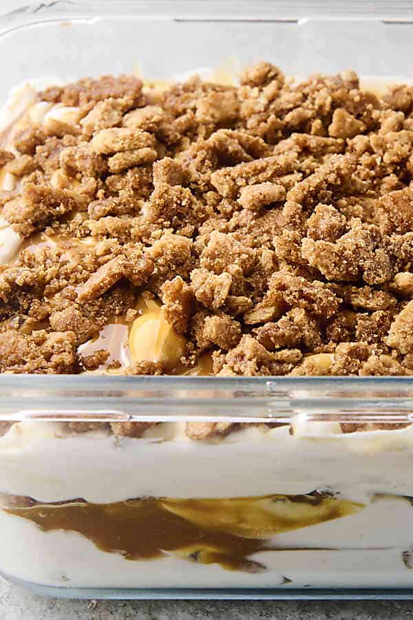 caramel apple ice cream with graham cracker crumble in a container