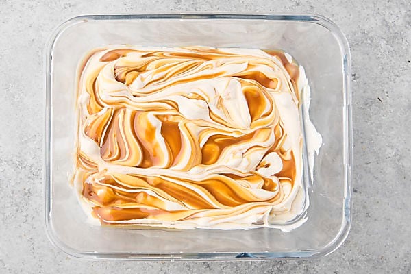 half of the caramel swirled into the ice cream