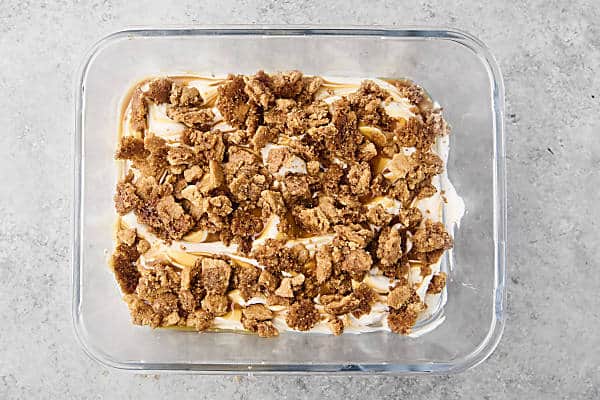 half of the graham cracker crumbles sprinkled on top of the caramel