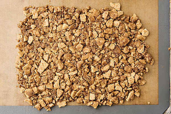 graham cracker crumble on a baking sheet before baking