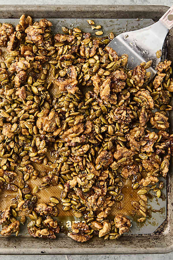 candied rosemary walnuts on a sheet pan