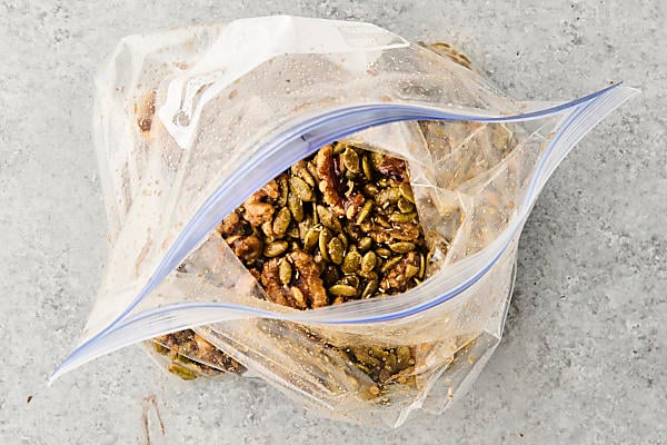 nuts and seeds shaken with sugar and spices in a baggie