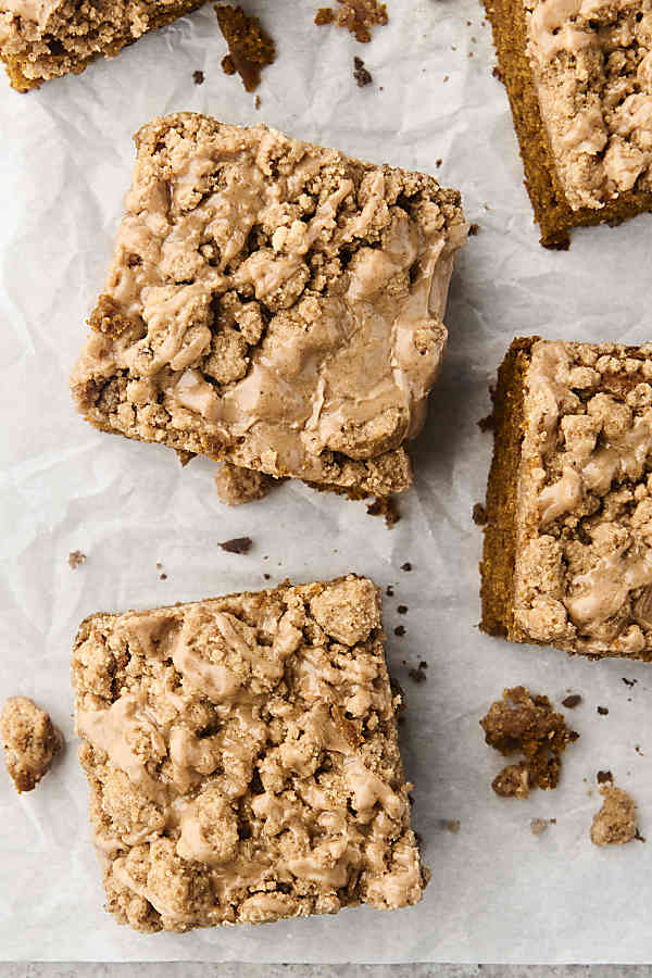 slices of pumpkin crumb cake on parchment paper