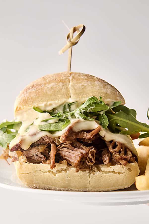 slow cooker french dip sandwich on a plate