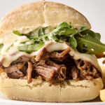 crockpot french dip sandwich on a plate
