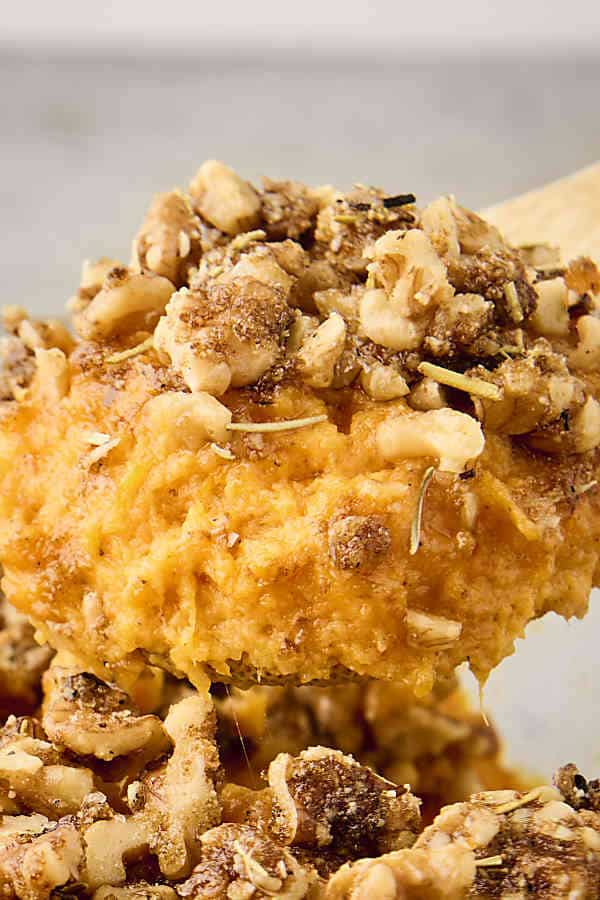 scoop of savory sweet potato casserole on a spoon