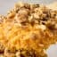 brown butter sweet potato casserole on a spoon