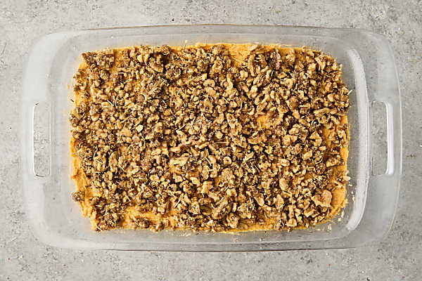 savory sweet potato casserole in a baking dish before baking