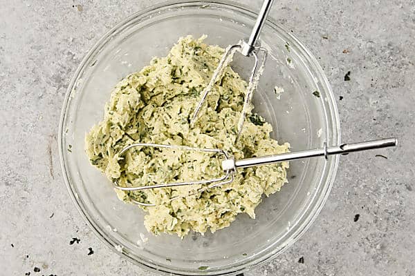 mixing herb butter in a bowl
