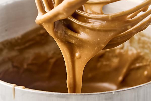 cooked maple brown sugar frosting in a saucepan