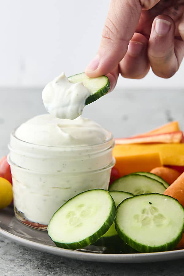 dunking vegetables into high protein low calorie ranch dressing