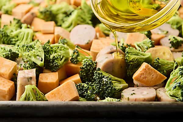 drizzle chicken sausage, broccoli, and sweet potato with oil