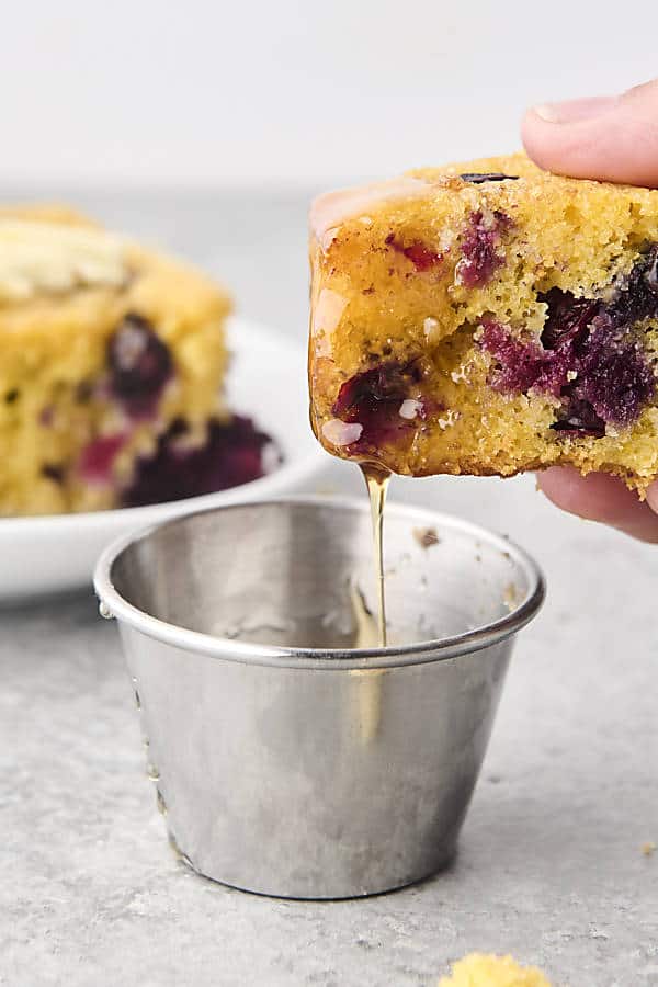 dunking cornbread into honey